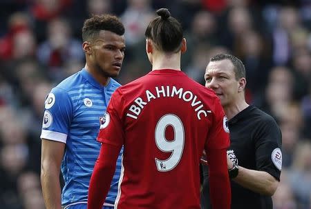 Britain Soccer Football - Manchester United v AFC Bournemouth - Premier League - Old Trafford - 4/3/17 Manchester United's Zlatan Ibrahimovic and Bournemouth's Tyrone Mings are spoken to by referee Kevin Friend Reuters / Andrew Yates