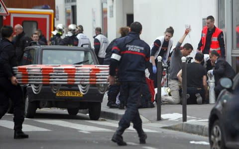 Twelve people died in the 2015 attack at satirical French newspaper Charlie Hebdo  - Credit: AP Photo/Thibault Camus, File