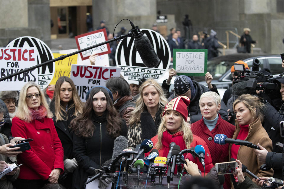 Rosanna Arquette speaks at a news conference outside a Manhattan courthouse after Harvey Weinstein arrived, Monday, Jan. 6, 2020, in New York. Behind her are, left to right, Louise Godbold, Dominique Huett, Sarah Ann Masse, Paula Williams, Rose McGowan, and Lauren Sivan. The disgraced movie mogul faces allegations of rape and sexual assault. (AP Photo/Mark Lennihan)