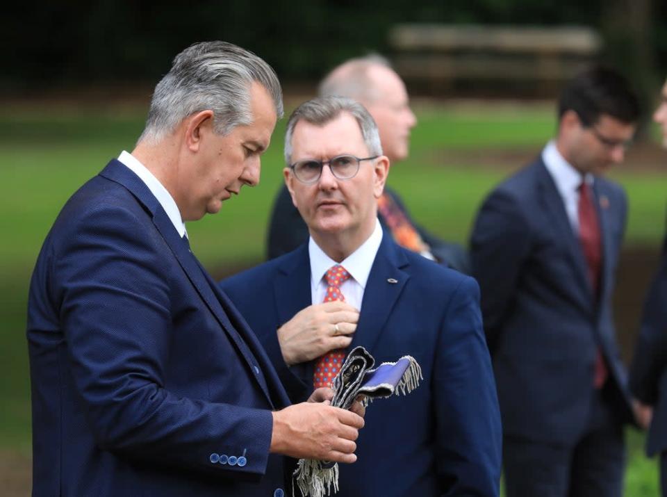 Former Democratic Unionist Party leader Edwin Poots talks with the man who replace him, Sir Jeffrey Donaldson during a Battle of the Somme commemoration (Peter Morrison/PA) (PA Wire)