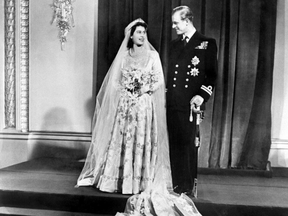 Britain's Princess Elizabeth (future Queen Elizabeth II) (L) and Philip, Duke of Edinburgh (R) pose on their wedding day at Buckingham Palace in London on November 20, 1947 (AFP via Getty Images)