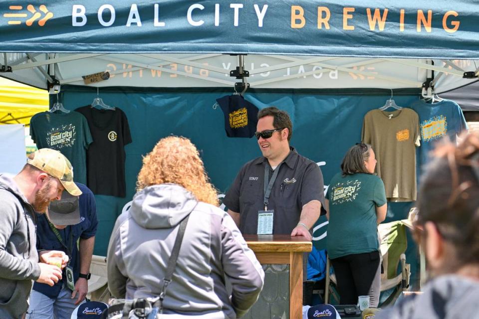 Mike Smith, brewmaster at Boal City Brewing, prepares to serve attendees Saturday at the Hoppy Valley Brewers Fest at Penn State’s Beaver Stadium. Jeff Shomo/For the CDT