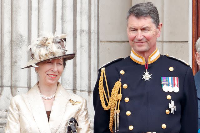 <p>Max Mumby/Indigo/Getty</p> Princess Anne and Vice Admiral Sir Timothy Laurence atch a flypast to mark the centenary of the Royal Air Force from the balcony of Buckingham Palace on July 10, 2018.