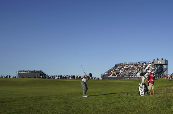 South Africa's Louis Oosthuizen goes to chip onto the 15th green during the third round of the British Open Golf Championship at Royal St George's golf course Sandwich, England, Saturday, July 17, 2021. (AP Photo)