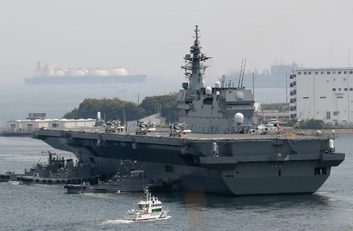 Japan's new five-year defence plan calls for the military to upgrade two existing "helicopter carriers" so that they will also be able to launch fighter jets (AFP Photo/STR)