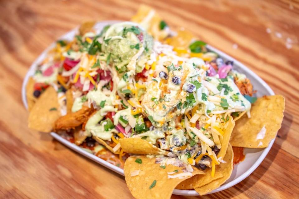 The nachos at Osito’s are served over homemade chips and include black beans, queso sauce, mixed cheese, guacamole, pimento cheese, pico, pickled okra, pickled red onions, jalepeños, lime crema, cilantro and any daily toppings available.