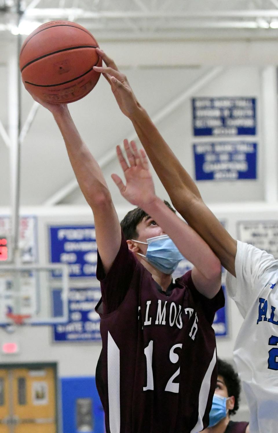 Jack Watson of Falmouth has his shot blocked by Dantae Clarke of Mashpee in this December 2021 photo.