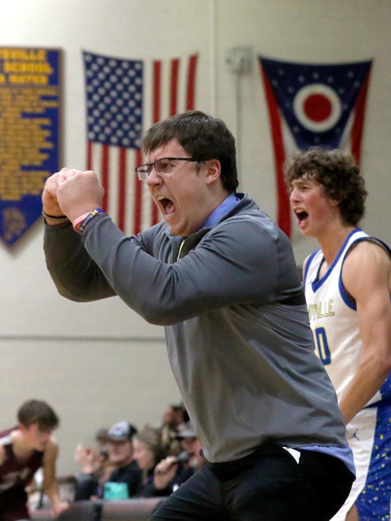 Head coach Dave Brown encourages his team's defense during the third quarter of Maysville's 45-28 win against visiting John Glenn on Friday night in Newton Township. The Panthers allowed two points during a 13-minute span in the second and third quarters as they moved into a tie for second place in the Muskingum Valley League-Big School Division standings.