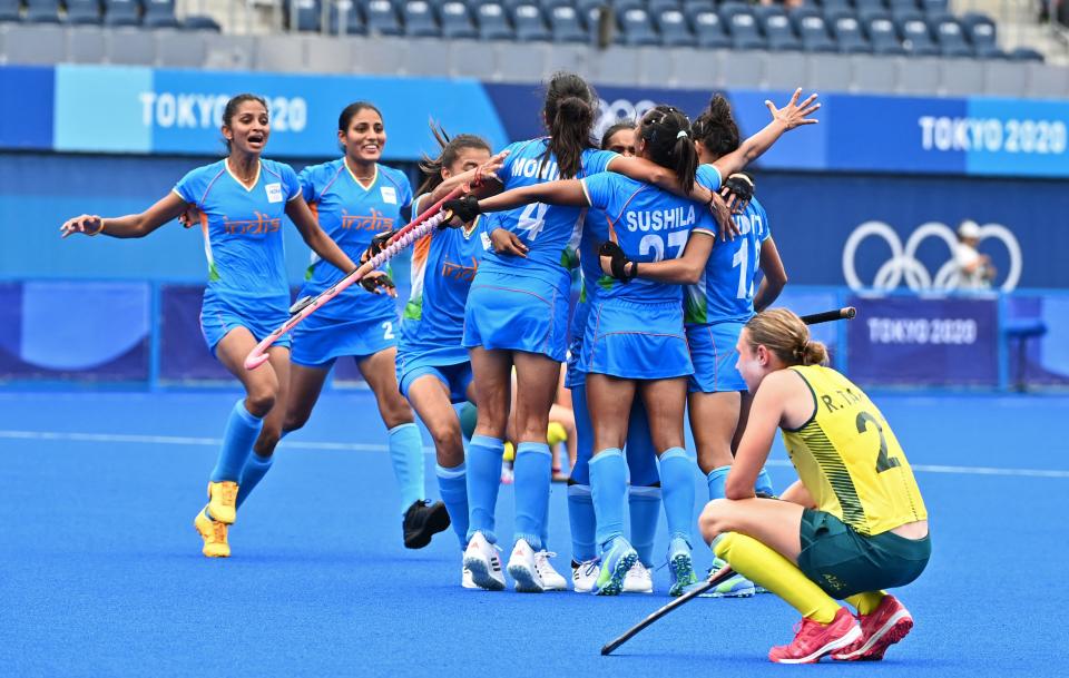 Players of India celebrate after defeating Australia 1-0 in their women's quarter-final match of the Tokyo 2020 Olympic Games field hockey competition, at the Oi Hockey Stadium in Tokyo, on August 2, 2021. (Photo by CHARLY TRIBALLEAU / AFP) (Photo by CHARLY TRIBALLEAU/AFP via Getty Images)