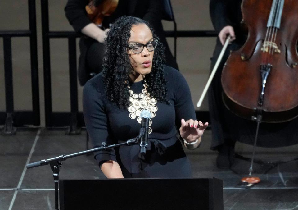 Poet La’Ketta D. Caldwell recites her poem, “The Fruit of Service,” during a public memorial service for former Bucks owner and U.S. senator Herb Kohl at Fiserv Forum in Milwaukee on Friday, Jan. 12, 2024. Kohl, 88, died Dec. 27 after a brief illness.
