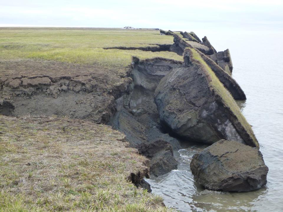 Permafrost thaw shows giant chunks of Earth falling into the ocean.