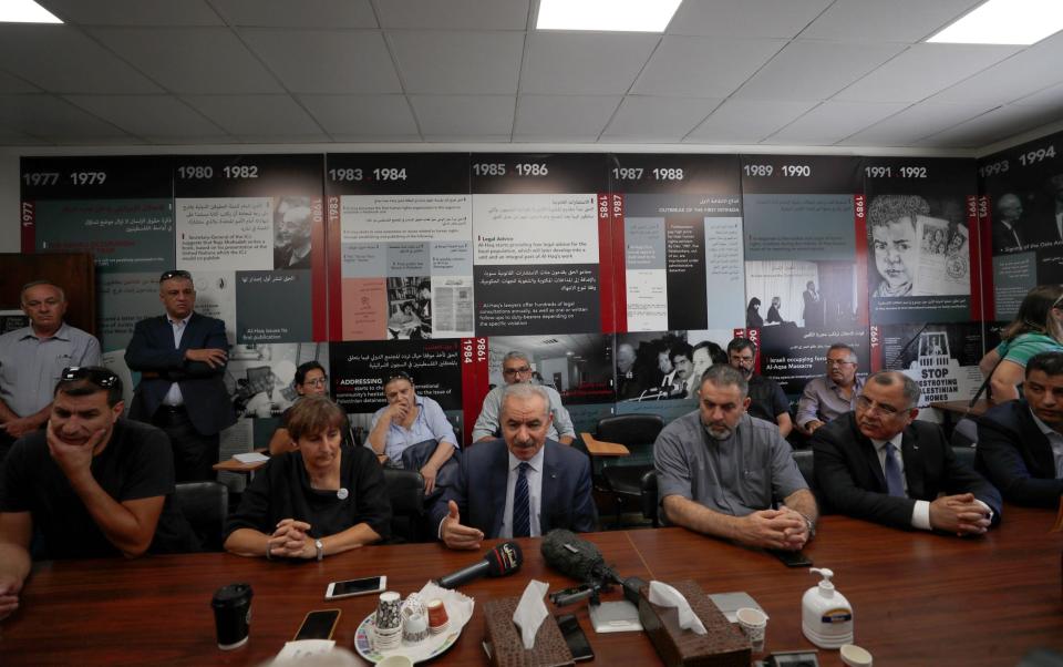 Palestinian authority Prime Minister Mohammad Shtayyeh (centre) meets with the heads of the six civil society organisations whose offices were raided by Israeli forces - Shutterstock