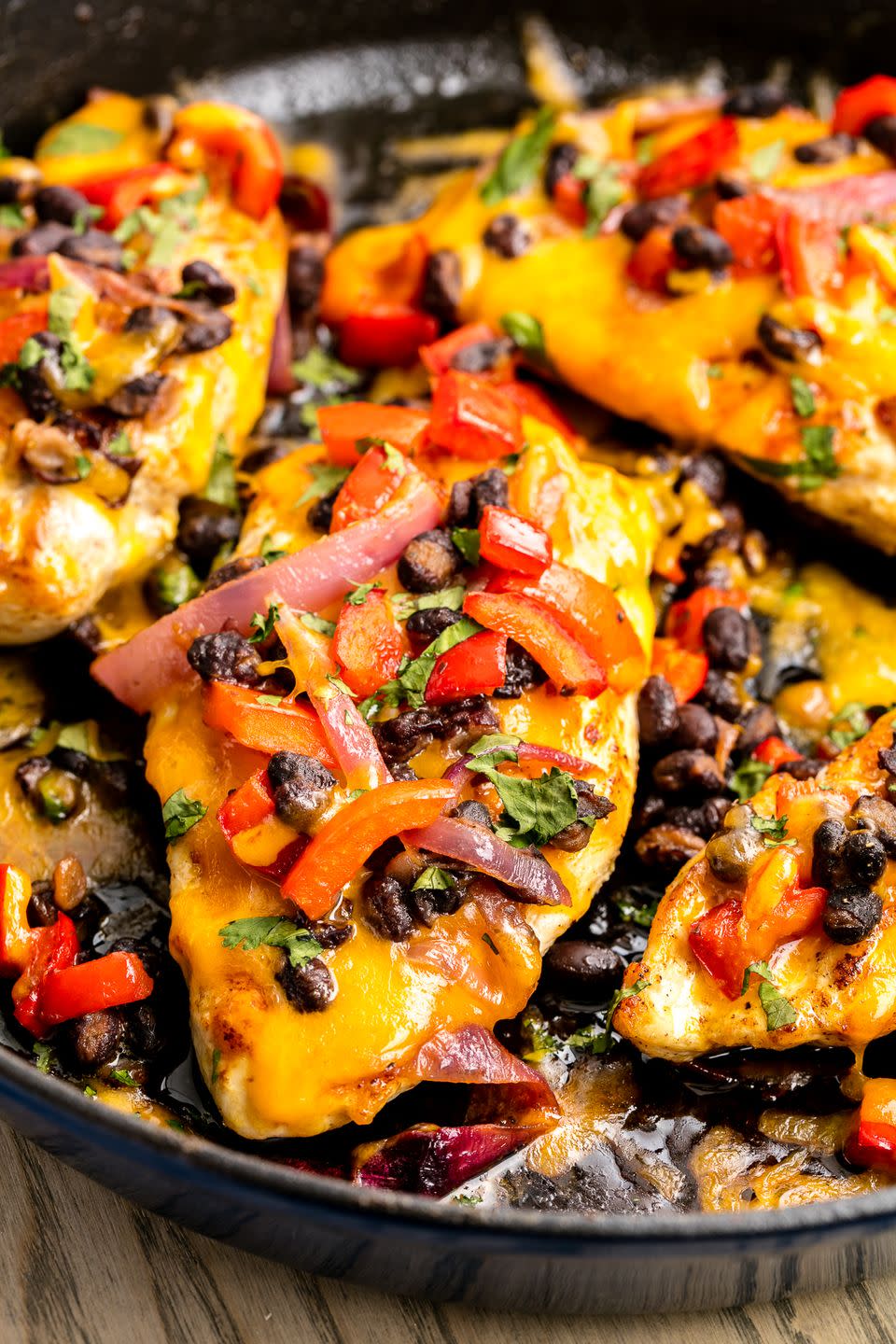 <p>Tex-Mex at its finest: This skillet chicken is topped with melty cheddar and a delicious black bean-red onion mixture.</p><p><span>Get the recipe from <a href="https://www.delish.com/cooking/recipe-ideas/recipes/a46562/santa-fe-skillet-chicken-recipe/" rel="nofollow noopener" target="_blank" data-ylk="slk:Delish;elm:context_link;itc:0;sec:content-canvas" class="link ">Delish</a><span>.</span></span></p>