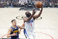 Los Angeles Clippers guard James Harden, right, shoots as Denver Nuggets forward Michael Porter Jr. defends during the first half of an NBA basketball game Thursday, April 4, 2024, in Los Angeles. (AP Photo/Mark J. Terrill)