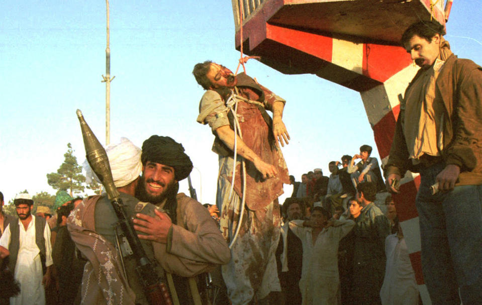 Image: Former Afghan President Najibullah's body hangs from a traffic post (B. K. Bangash / Ap file)