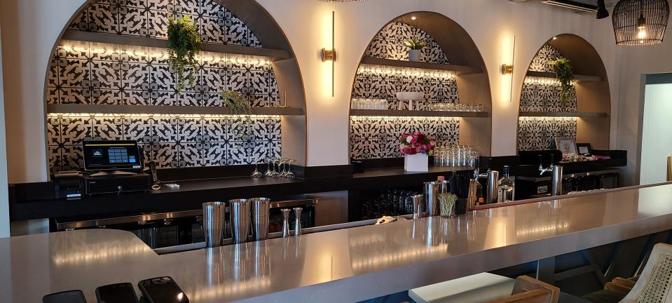 Unidos's bar boasts gorgous tile and fun lighting fixtures.