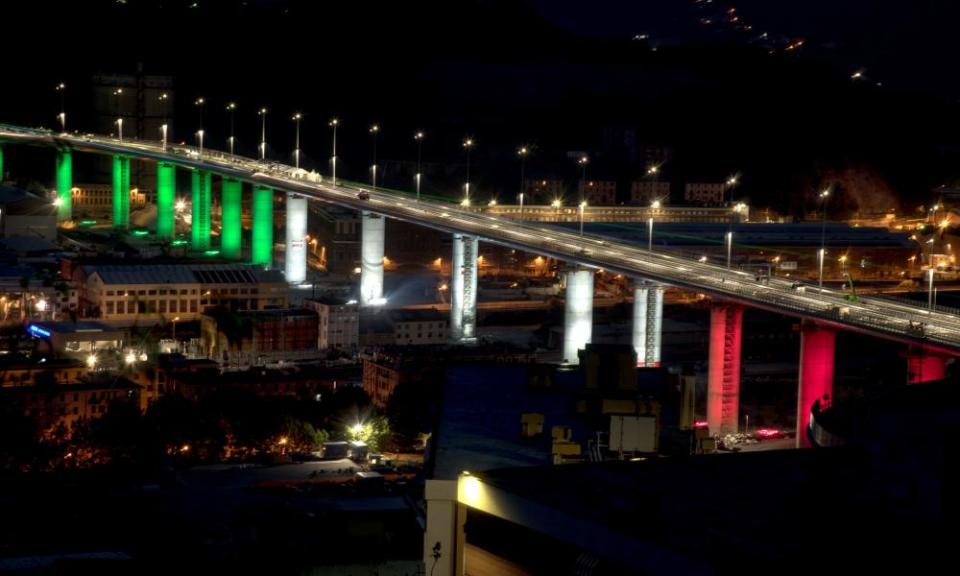 The 18 pillars of the new Genoa bridge illuminated with the colours of the Italian flag days before its inauguaration