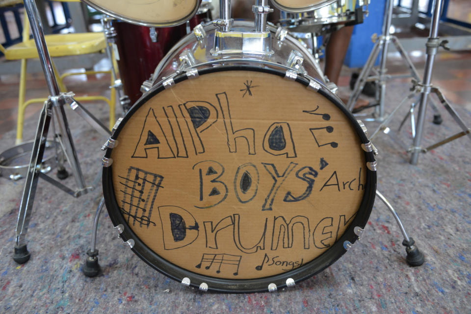 In this Feb. 17, 2014 photo, a cardboard cutout is shown displayed on the bass drum of the band’s kit at the Alpha Boys’ School, a residential vocational school in Kingstom, Jamaica. The school has been a cornerstone of Jamaica’s prolific musical culture for over a century, producing numerous musicians who have taken the homegrown musical genres of ska, rocksteady and reggae to the world. At the school, students between 8 and 18 are taught to read music and understand harmony and composition, if they don’t focus on the school’s more traditional trades like woodworking and tailoring. (AP Photo/David McFadden)