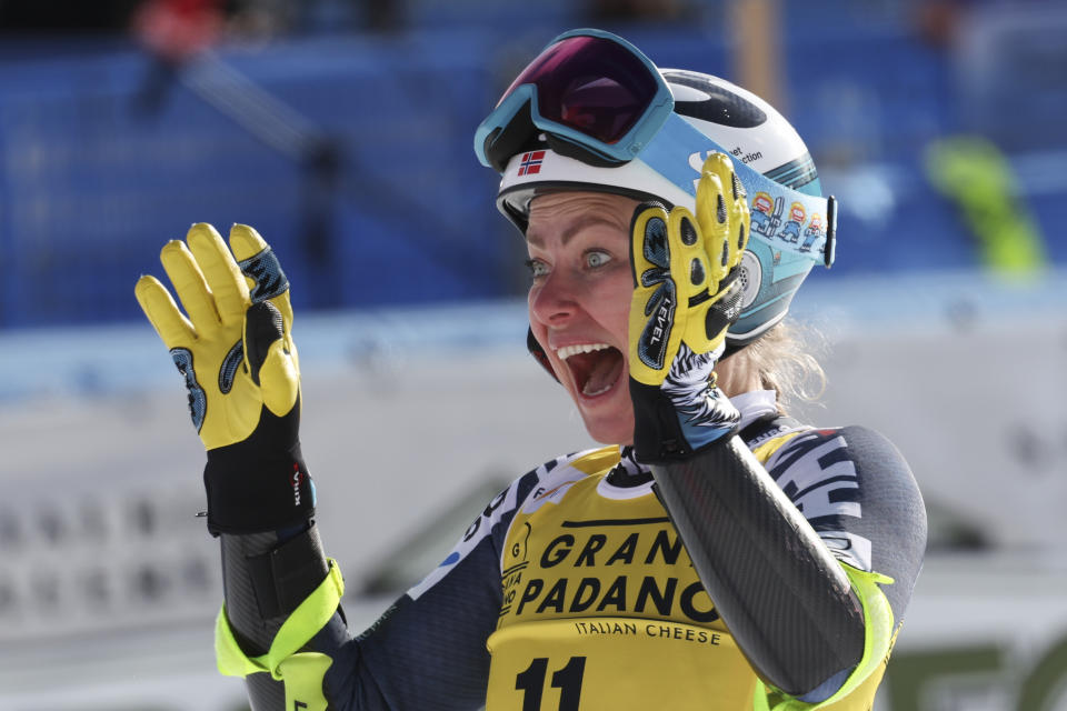 Norway's Ragnhild Mowinckel celebrates after completing an alpine ski, women's World Cup super-G, in Cortina d'Ampezzo, Italy, Sunday, Jan. 22, 2023. (AP Photo/Alessandro Trovati)