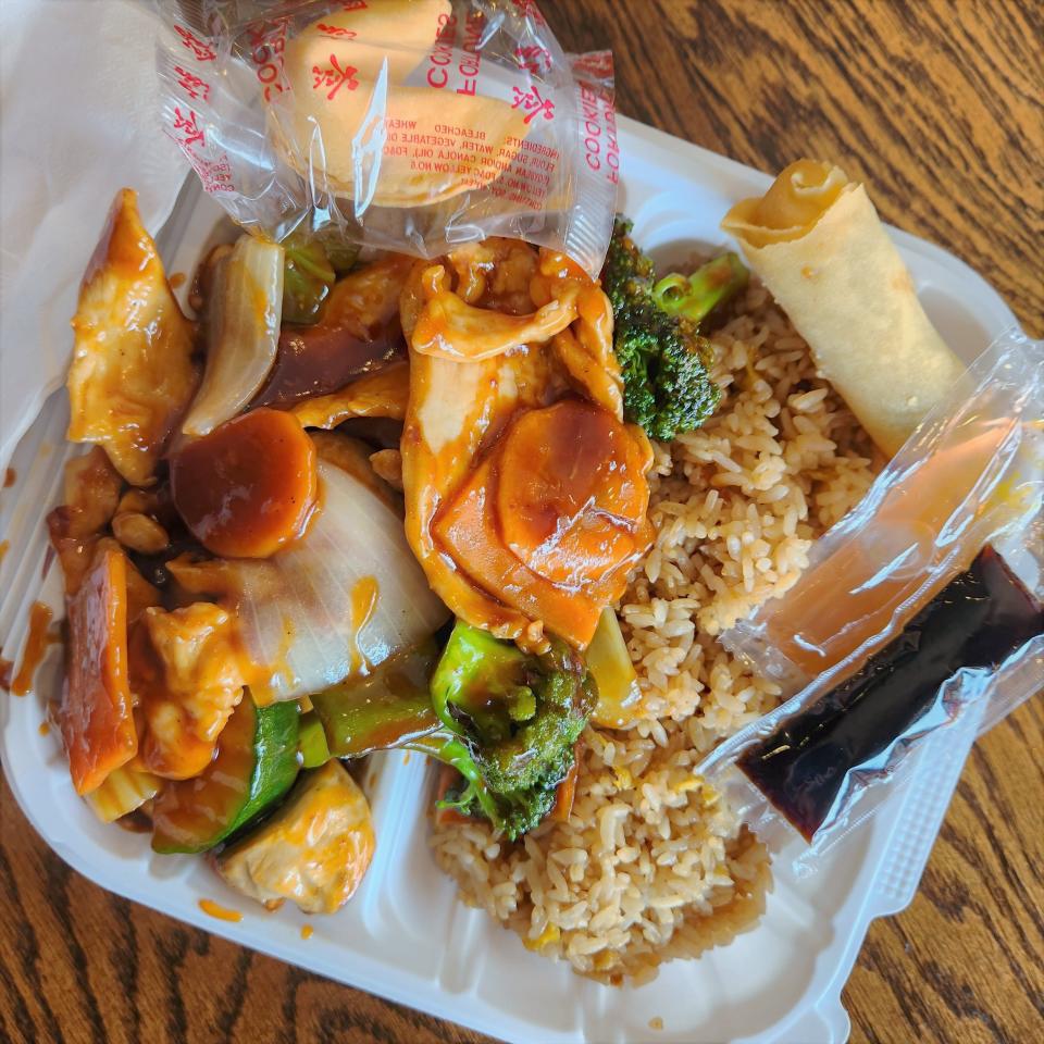 A a dish of Szechuan chicken from the lunch special menu is served at the Takeout Express restaurant in Evansville on Wednesday, July 19, 2023.