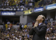 Atlanta Hawks head coach Mike Budenholzer looks up at the scoreboard during the second half in Game 2 of an opening-round NBA basketball playoff series against the Indiana Pacers Tuesday, April 22, 2014, in Indianapolis. Indiana defeated Atlanta 101-85. (AP Photo/Darron Cummings)