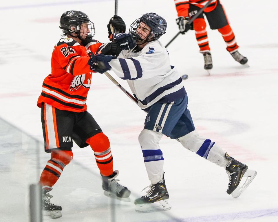 Middleboro's Sam Steinman is shoved during a game against Sandwich at Gallo Ice Arena in Bourne on Wednesday, Feb. 7, 2024.