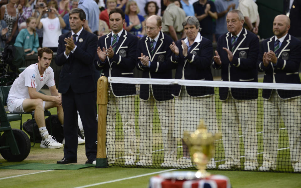 Andy Murray of Britain sits in his seat after being defeated by Roger Federer of Switzerland in their men's singles final tennis match at the Wimbledon Tennis Championships in London July 8, 2012. REUTERS/Dylan Martinez (BRITAIN - Tags: SPORT TENNIS) 