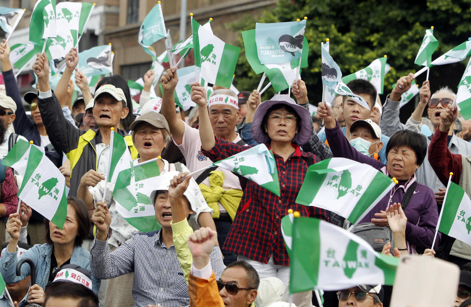 Pro-independence demonstrators shout slogans during a rally in Taipei, Taiwan, Saturday, Oct. 20, 2018. Thousands of the demonstrators gathered in Taiwan’s capital on Saturday to express their disapproval with China’s stance toward their island. (AP Photo/Chiang Ying-ying)