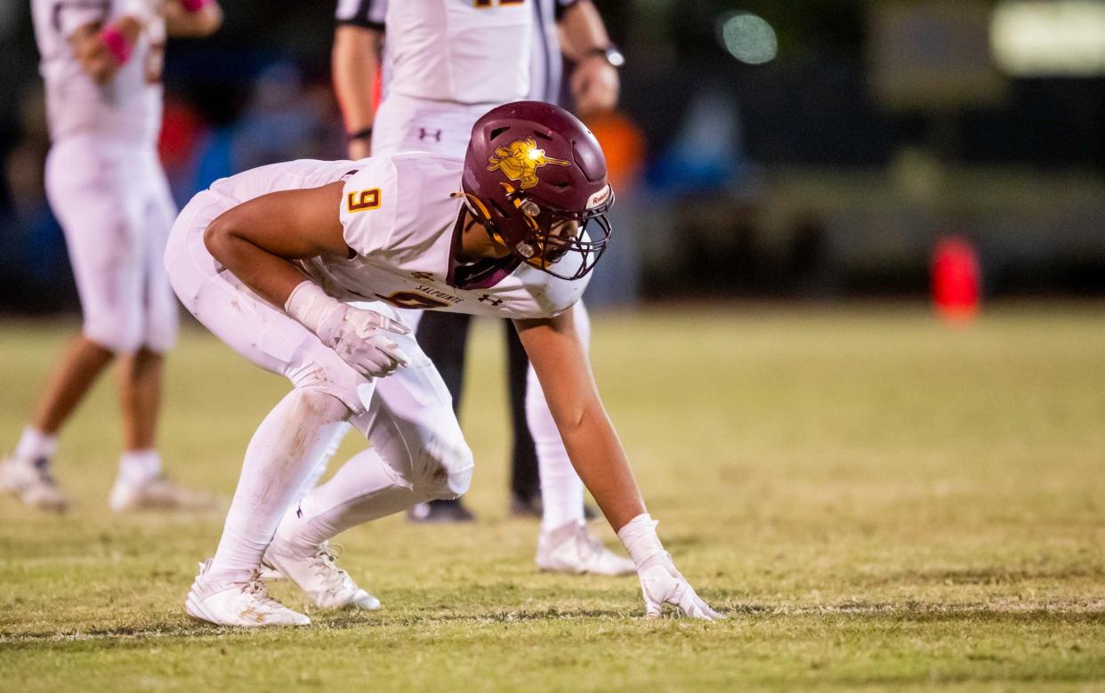 Salpointe Catholic defensive end Elijah Rushing (9) sets up for a play at Liberty High School's football field in Peoria, Arizona, on Oct. 13.