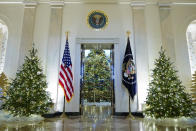 Cross Hall and the Blue Room of the White House are decorated for the holiday season during a press preview of holiday decorations at the White House, Monday, Nov. 28, 2022, in Washington. (AP Photo/Patrick Semansky)