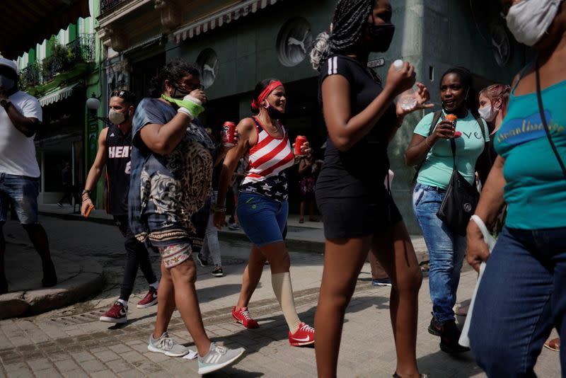 A woman wears a T-shirt with colors of the U.S. flag in downtown Havana