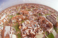 <p>This Sept. 4, 1992 aerial picture taken with a fish eye lens shows the devastation left by Hurricane Andrew in Florida City, Fla. As of Friday, Sept. 5, 2008, Ike is still far out in the Atlantic, but it’s getting a close look from those who weathered 1992’s Andrew, the devastating Category 5 storm against which all other Florida hurricanes are measured. (AP Photo/Mark Lennihan) </p>