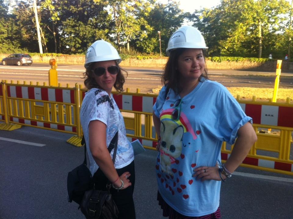The author (right) and her friend wearing hard hats at Dokumenta in Kassel, Germany in 2012.