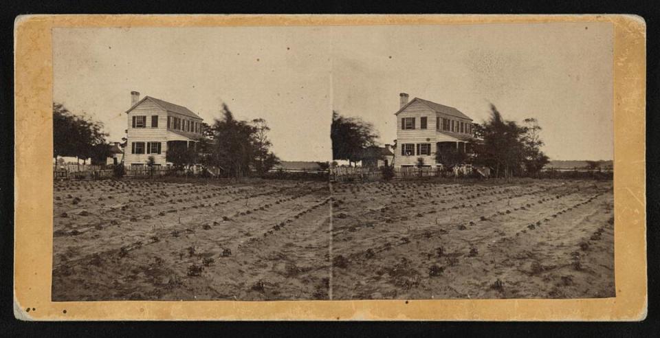 A plantation home sits on farmland near Beaufort, SC between 1862 and 1864.