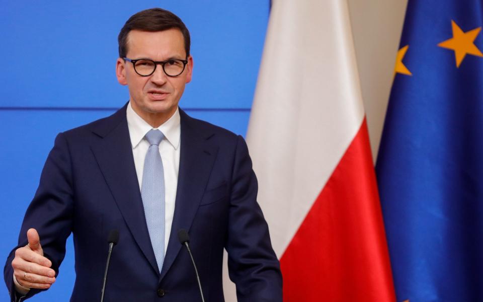 Polish Prime Minister Mateusz Morawiecki gives a press conference at the end of the second day of a European Union leaders meeting at the Polish Permanent Representation to the EU in Brussels - STEPHANIE LECOCQ/EPA-EFE/Shutterstock