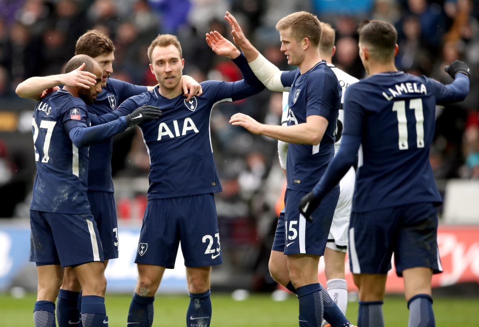 Tottenham Hotspur’s Christian Eriksen (centre) celebrates scoring his side’s third goal of the game