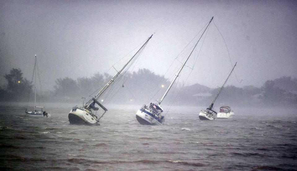 <p>Boats tip in heavy winds near Venice, Florida, on Sept. 28.</p>