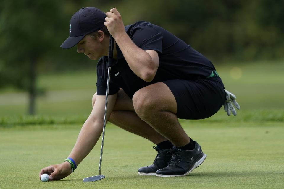 Harrison's Jack Ward prepares to putt during the Best of the West high school boys golf tournament at Miami Whitewater Golf Course on Sunday, Sept. 25, 2022.