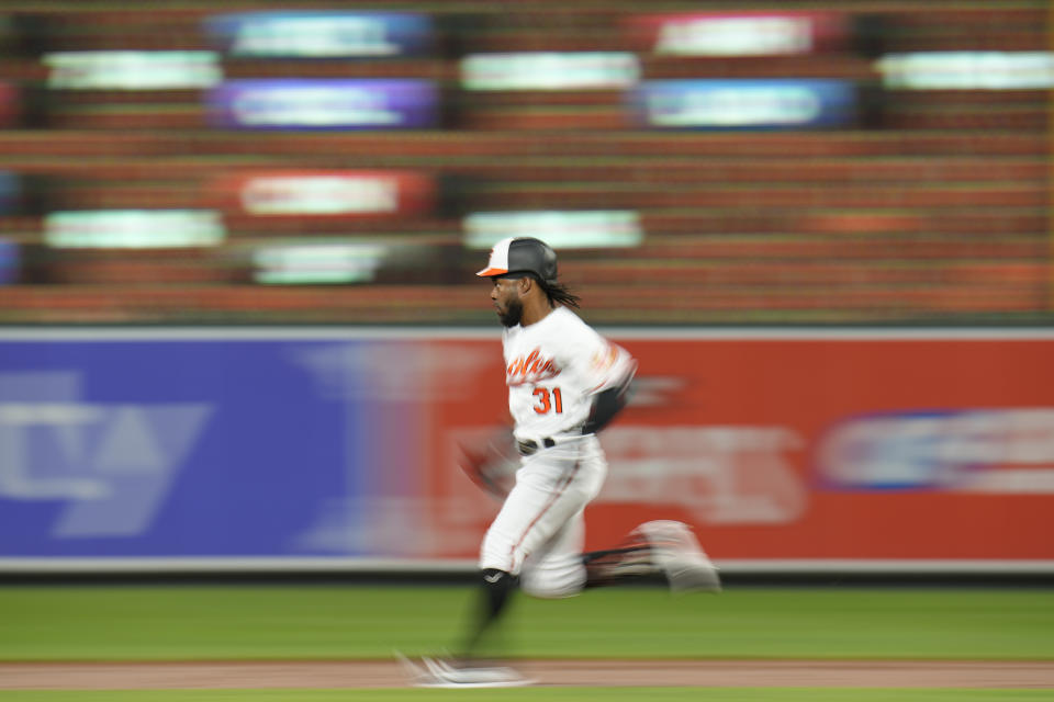 Baltimore Orioles' Cedric Mullins runs while collecting a double against the Chicago White Sox during the second inning of a baseball game, Monday, Aug. 28, 2023, in Baltimore. (AP Photo/Julio Cortez)