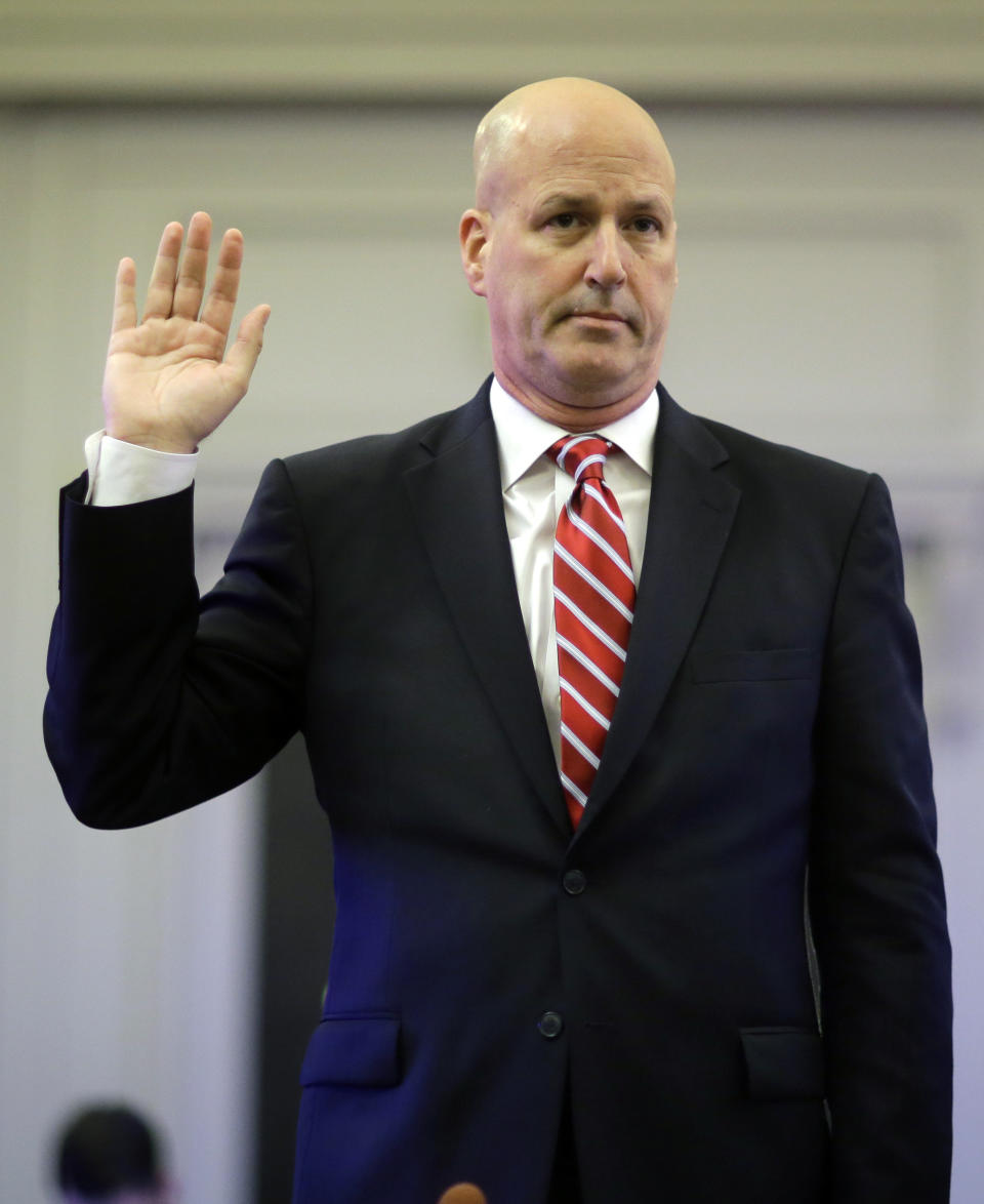 Michael Drewniak, chief spokesman for Gov. Chris Christie, is sworn in Tuesday, May 13, 2014, before the state legislature's Select Committee on Investigation in Trenton, N.J. The committee is probing the politically motivated closure of access lanes to the George Washington Bridge in Fort Lee last September. (AP Photo/Mel Evans)