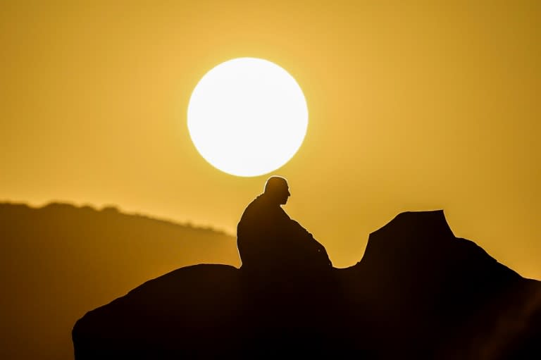 A Muslim pilgrim prays at dawn on Mount Arafat during this year's hajj (Fadel SENNA)