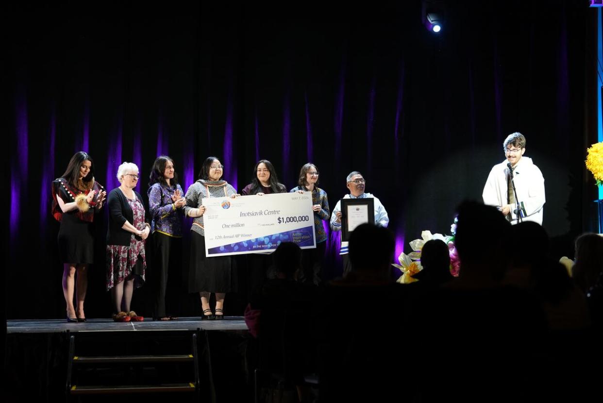 The team behind the Inotsiavik Centre collect their $1 million award at the 2024 Arctic Inspiration Prize. Nicholas Flowers, far right, says the money isn't for the team 