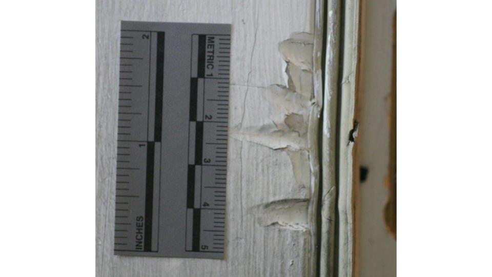 Nick Firkus' defense team says marks on the door show there was an intruder.  / Credit: Ramsey County Attorney's Office