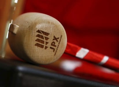 FILE PHOTO: A logo of Japan Exchange Group Inc. is seen on a gavel before the New Year opening ceremony at the Tokyo Stock Exchange (TSE), held to wish for the success of Japan's stock market, in Tokyo, Japan, January 4, 2016. REUTERS/Yuya Shino