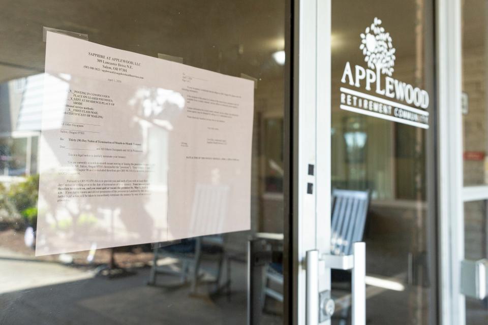 A notice is taped to the entrance of Applewood Retirement Community that residents need to leave by May 1.