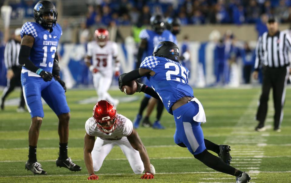 Kentucky’s Jordan Lovett catches an interception against Louisville.Nov. 26, 2022