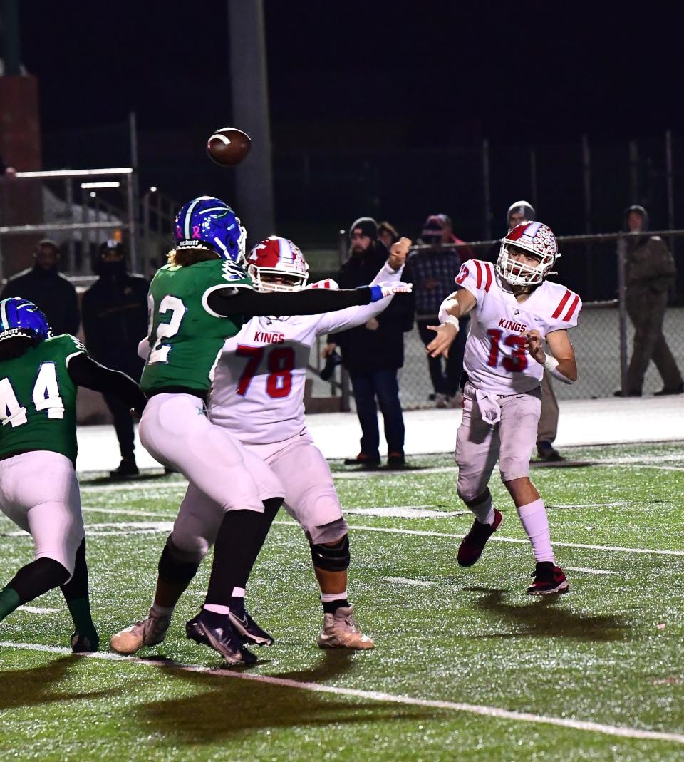 Will Kocher (13) threads the needle for a completed pass for Kings at the OHSAA Division II region semifinal football game, Nov. 11.