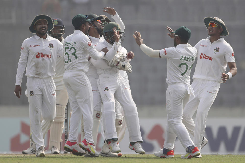Bangladesh players celebrate the wicket of India's Cheteshwar Pujara on the day two of the second test cricket match Bangladesh between India, in Dhaka, Bangladesh, Friday, Dec. 23, 2022. (AP Photo/Surjeet Yadav)