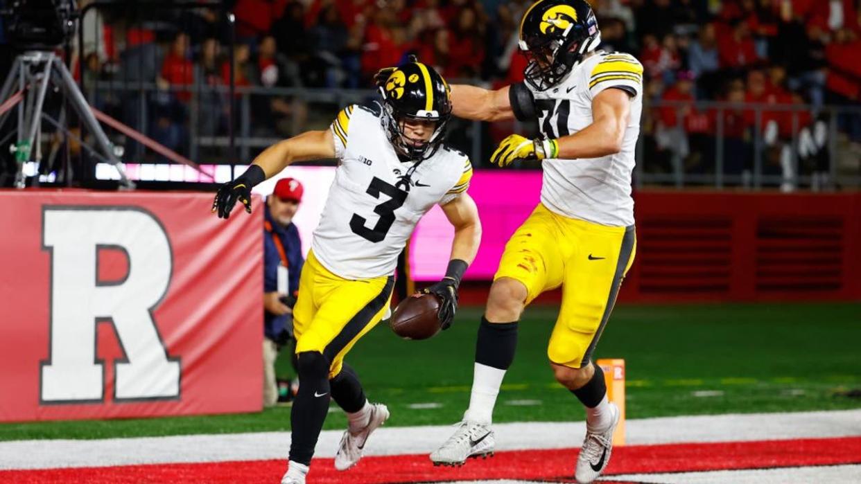 <div>PISCATAWAY, NJ - SEPTEMBER 24: Iowa Hawkeyes defensive back Cooper DeJean (3) celebrates with teammate Iowa Hawkeyes linebacker Jack Campbell (31) after intercepting a pass and scoring a touchdown during the first quarter of the college football game between the Rutgers Scarlet Knights and the Iowa Hawkeyes on September 24, 2022 at SHI Stadium in Piscataway, New Jersey. (Photo by Rich Graessle/Icon Sportswire via Getty Images)</div>