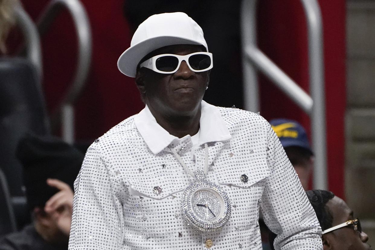 Entertainer Flavor Flav watches in the second half of the Pistons' 150-130 loss on Monday, Jan. 23, 2023, at Little Caesars Arena.